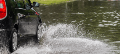 Car splashing through pond.