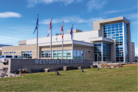 Fire Station - Grey building with windows with Canada and Alberta flags